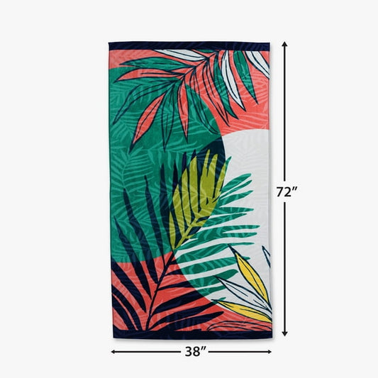 Tropical leaf patterned towel with dimensions on a white background